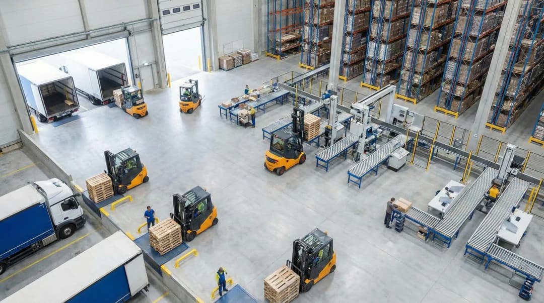 Isometric warehouse facility showing putaway process with forklifts, storage racks, and loading dock
