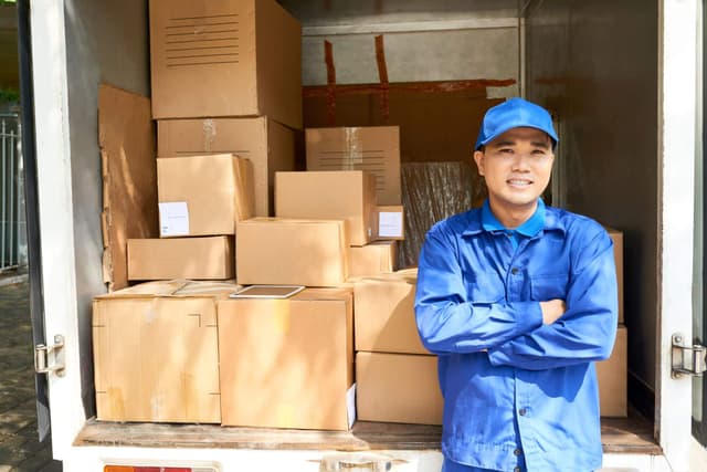 courier-standing-at-truck-loaded-truck