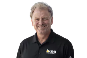 Professional man in black Cadre polo shirt smiling at camera