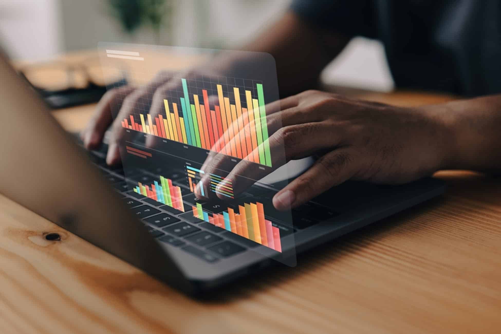 a person on a computer with an chart overlay