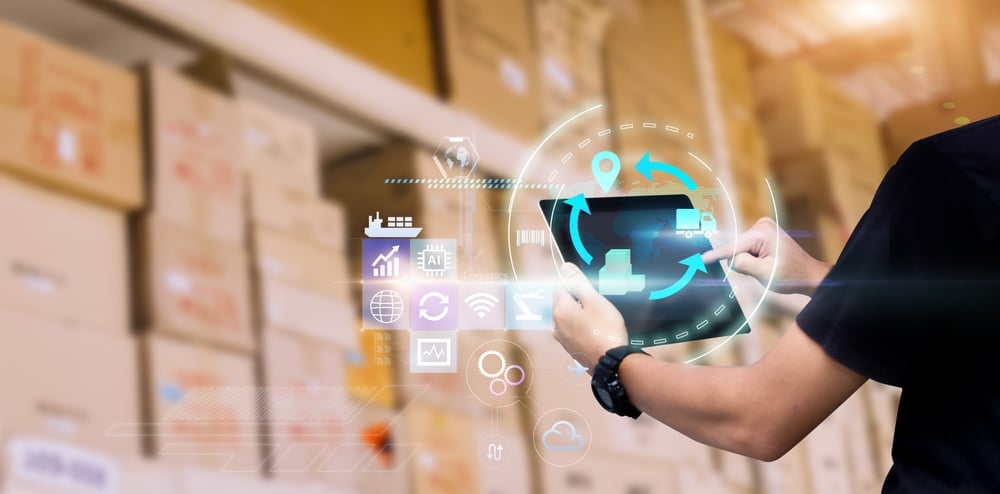 man holding 3rd party logistics billing software solution tablet in warehouse