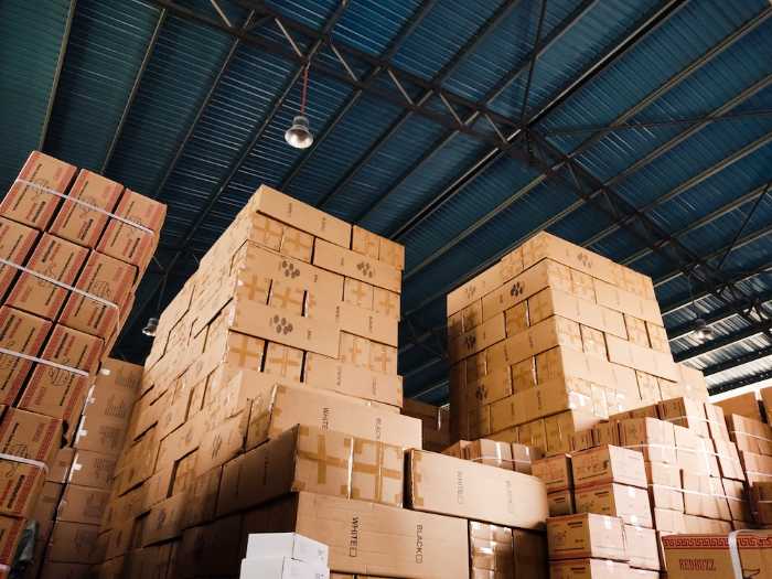 Cartons piled high in a warehouse