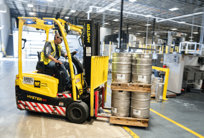 Forklift moving kegs