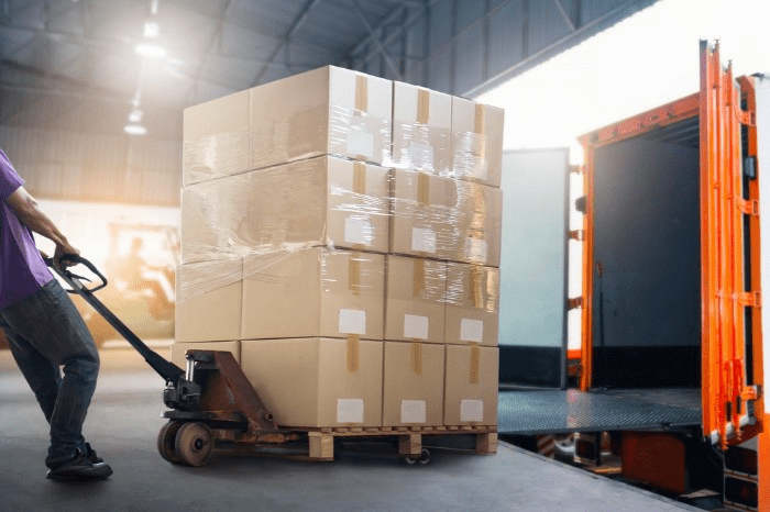 warehouse worker putting away a pallet of inventory