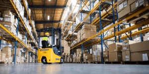 forklift moving boxes in a warehouse