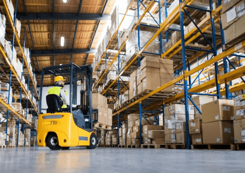 forklift moving boxes in a warehouse