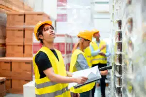 warehouse workers receiving products and checking them for putaway