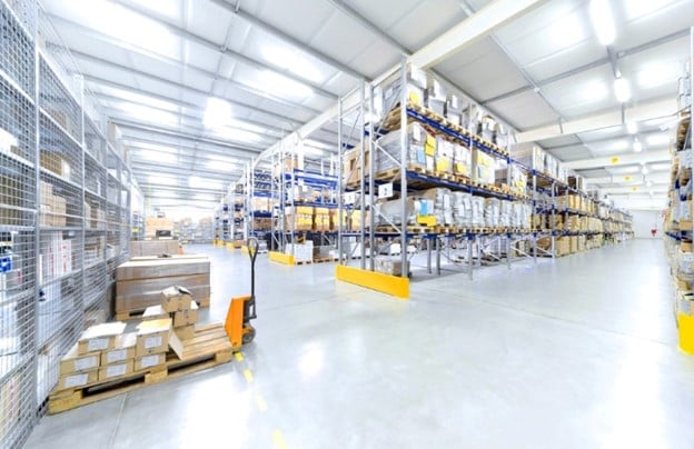 warehouse with racking and pallet movers