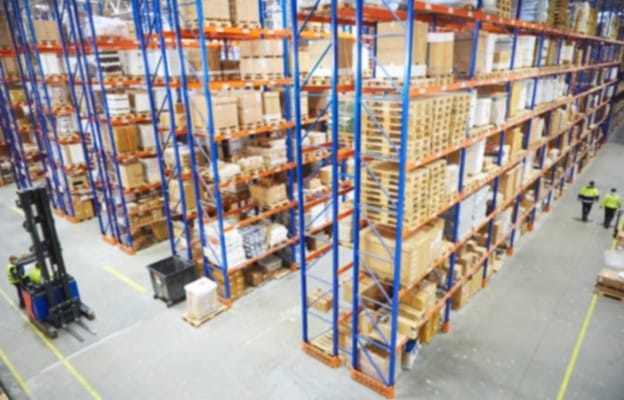 warehouse with tall storage racks and forklift