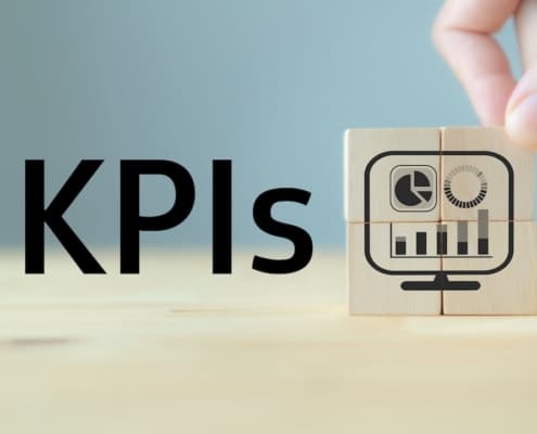 KPIs and a wood block with a screen icon showing charts and graphs