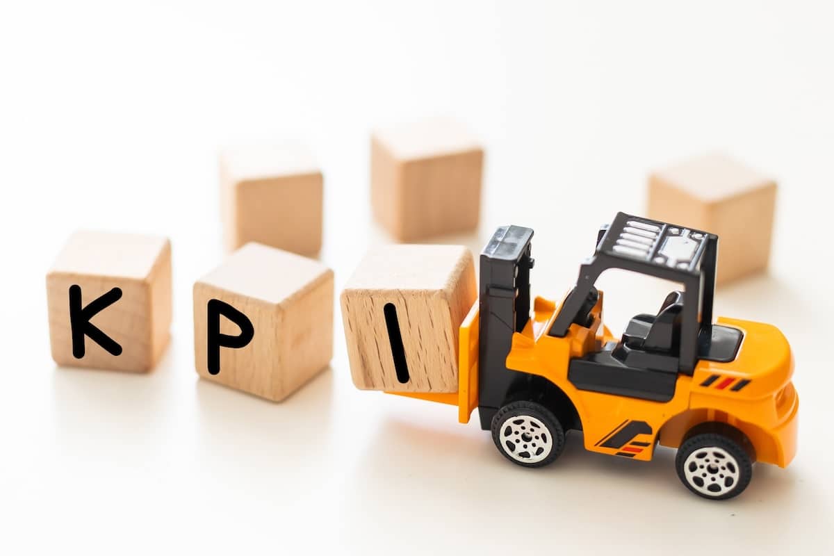 forklift moving blocks spelling out KPI