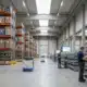 Modern warehouse with organized shelving systems and inventory management for WMS software implementation