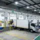 Safe warehouse loading dock with organized trucks and safety equipment