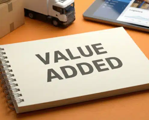 Spiral notebook displaying "VALUE ADDED" text on orange background for 3PL services
