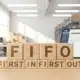 Wooden blocks spelling FIFO with First In First Out below for inventory management