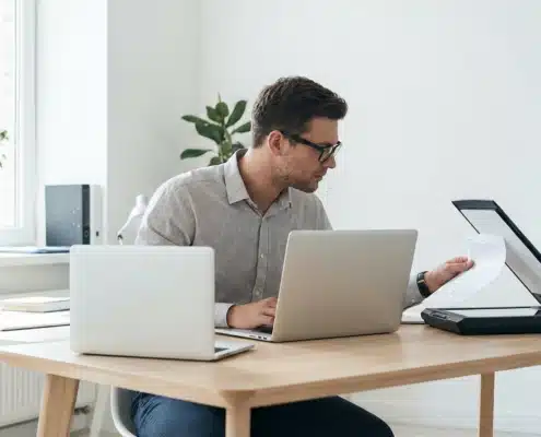 person scanning while on laptop