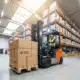 forklift moving boxes in a warehouse