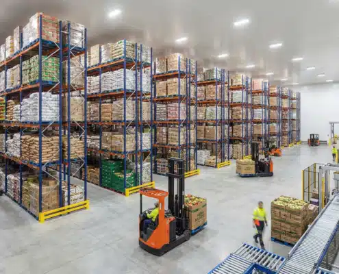 Modern food warehouse with organized inventory shelving and forklift equipment