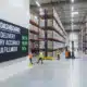 warehouse interior with 3pl kpi sign