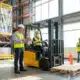 male and female workers doing warehouse forklift safety training