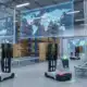 Modern supply chain warehouse with robotic forklifts and digital transportation maps enhancing visibility.